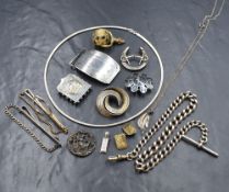 An assortment of silver jewellery, including a curb link Albert watch chain, brooches, a belt buckle