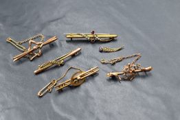 Five yellow metal bar brooches, all stamped 9ct and of various designs, some damage, approx 8.7g