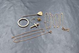 A 9ct gold diamond set stick pin, the shield with a central diamond, marked 375, along with a