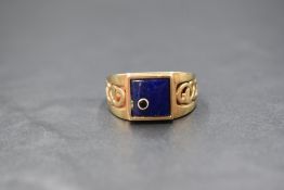 A 9ct gold lapis lazuli and sapphire set signet ring, the square lapis lazuli panel having an
