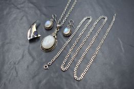 A collection of silver jewellery, comprising a statement moonstone set pendant on a silver belcher