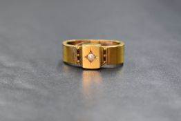 A 15ct gold pearl set cravat ring, of traditional form with a central split pearl in a decorative