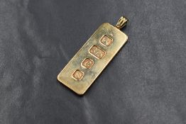 A 9ct gold ingot pendant, the bar marked with London 1977 hallmarks and 375, on a pendant loop,