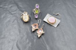 A small selection of silver and white metal jewellery including a Suffragettes coloured ring,