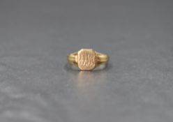 A 9ct gold signet ring, the square panel having 'DW' engraved and 'ML' to reverse, with decorative