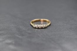 An 18ct gold diamond set five stone ring, the graduated diamonds measuring between 0.04ct and 0.