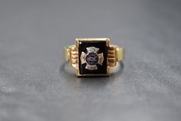 A gent's yellow metal signet ring stamped 10K bearing an enamelled panel regarding the Independent