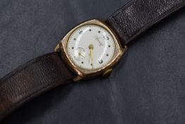 A gent's 1940's 9ct gold mechanical wrist watch by Accurist having dot and numeral dial with