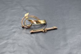 A 9ct gold brooch of naturalistic form and a bar brooch having central clover leaf with seed pearl