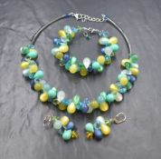 A suite of Coeur De Lion jewellery of teardrop form in tones of green and yellow including necklace,