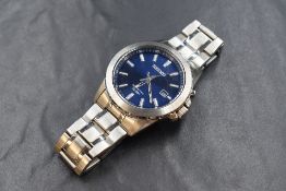 A Seiko Kinetic Date wristwatch, the navy blue dial having baton numerals and date aperture,