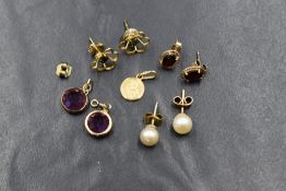 A small selection of yellow metal and 9ct gold jewellery including earrings, St Christopher charm