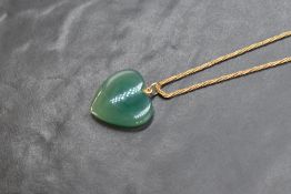 A 14ct gold rope neck chain, marked 585, with a chalcedony heart pendant, 9.5g