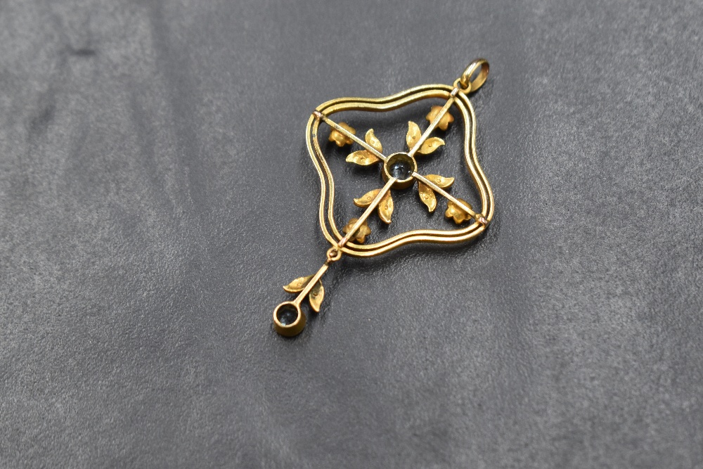 An Edwardian 9ct gold aquamarine and seed pearl set pendant, the central bezel set aquamarine in a - Image 2 of 2