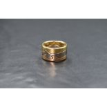 An 18ct three tone gold Georg Jensen Fusion ring, the three interlocking rings of yellow, white