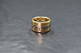 An 18ct three tone gold Georg Jensen Fusion ring, the three interlocking rings of yellow, white