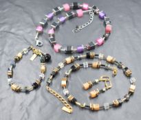 A Coeur De Lion Geo cube necklace in shades of pink