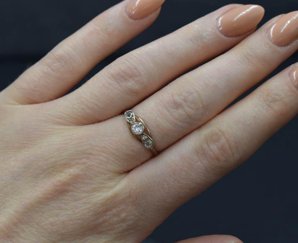 A 9ct gold diamond set five stone ring, the central round cut diamond measuring approximately 0.20ct - Image 4 of 4
