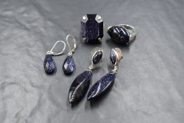 A small selection of silver and blue sandstone jewellery including two pairs of earrings and two