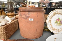 A stoneware jar with wooden cover, h29cm Condition report: Damages