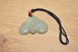 A Chinese carved jade or hardstone pendant / amulet of heart form, h4.5cm