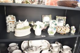 A ceramic oval trinket with cover decorated with rabbit figures, h13cm, sold together with a pair of