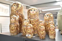 A nest of hand painted wooden dolls