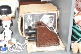 A vintage Dux Episcop bakelite projector with box, sold together with a stamp album