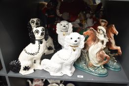 A pair of black and white Staffordshire style dogs, h31cm sold together with a similar pair ect