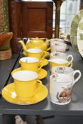 A yellow Shelley fine bone china tea service comprising of 1 tea pot, 1 cream jug and 3 cup and