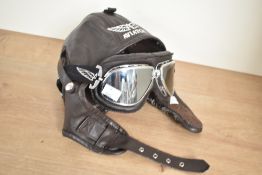 A padded leather Aviator helmet with goggles
