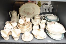 A Royal Doulton 'Lisette' fine bone china dinner service, to include tea pot, coffee pot and cream