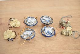 A set of 4 porcelain hanging fish plates, w6cm, sold together with two water buffalos, a ram and