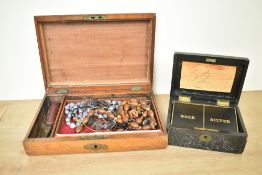 Two wooden jewellery boxes, both containing a small assortment of costume jewellery, including