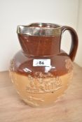A Victorian stone ware hunting jug in the style of Doulton Lambert pottery, having silver collar rim