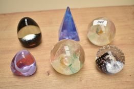 A Caithness Daydream glass paperweight, h7.5cm, sold together with 5 others