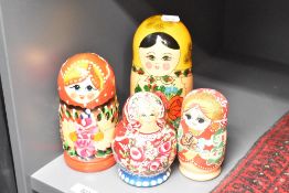 Four nests of Russian style dolls
