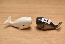 A pair of novelty salt and pepper condiments in the form of whales, L10cm