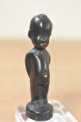 A miniature metal figure depicting an African child, h6.5cm