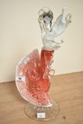 A Murano style hand blown glass figure of a flameco dancer raised on a circular footed base, h34cm