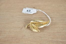 A Sphinx yellow metal costume leaf brooch, the leaf motif brooch in a brushed textured design