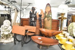 A carved wooden folk art sculpture of an old woman, h58cm, sold together with a carved wooden figure