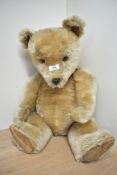 A vintage 1950's golden mohair (with black guard hair) Chiltern Hugmee teddy bea, having amber and