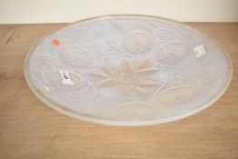 A large French Lalique style opalescent glass bowl in the Art Deco style having moulded foliage