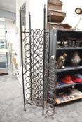 Two metal wine racks, largest h167cm