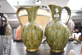 A pair of W.German vases having shaped handle and a green glaze ground, h31.5cm
