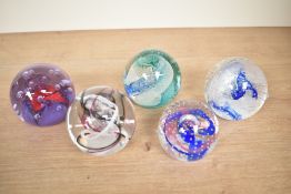 A Caithness 'Sparkle' glass paperweight, patter no 'v59259', h7cm, sold together with 5 others