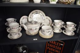 A Royal Worcester 'June Garland' pattern tea service, having gilt edges and floral motifs, to