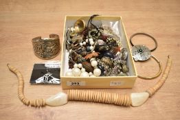 An assortment of costume jewellery, including statement pieces, bangles and brooches