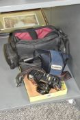 A Canon T50 camera with cover and carry case